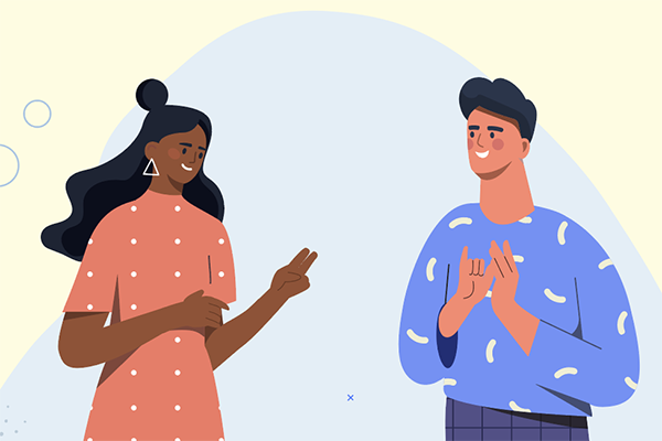 Two people communicating using sign language.