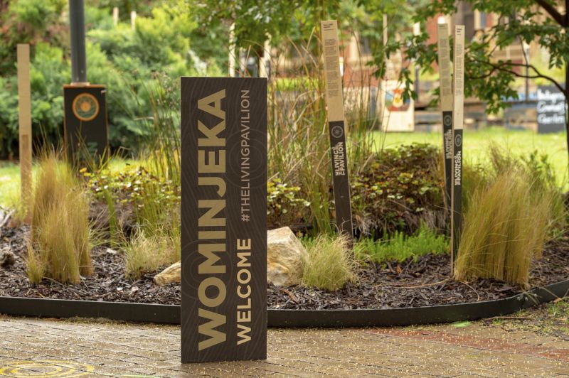 A shot of the outdoor gallery landscape, with a sign reading 'Wominjeka'
