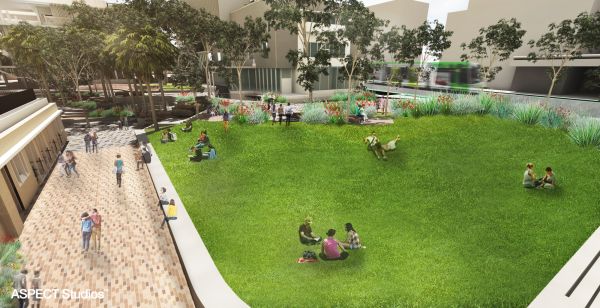 students enjoyng the sun on a large, green lawn in a digital render of the New Student Precinct
