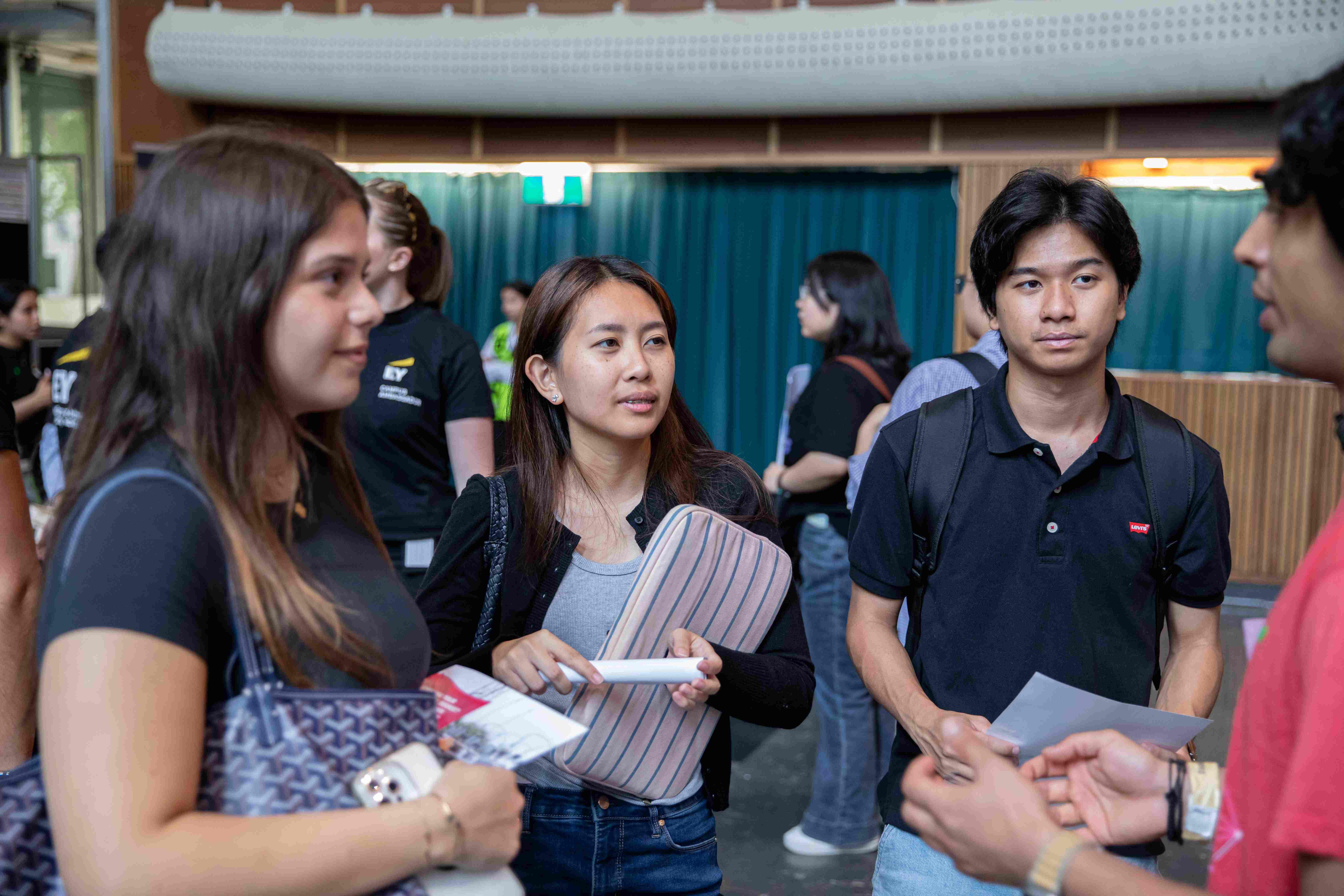 A group of students chatting at a fair