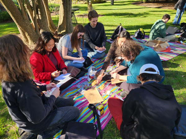group sitting on picric rug 